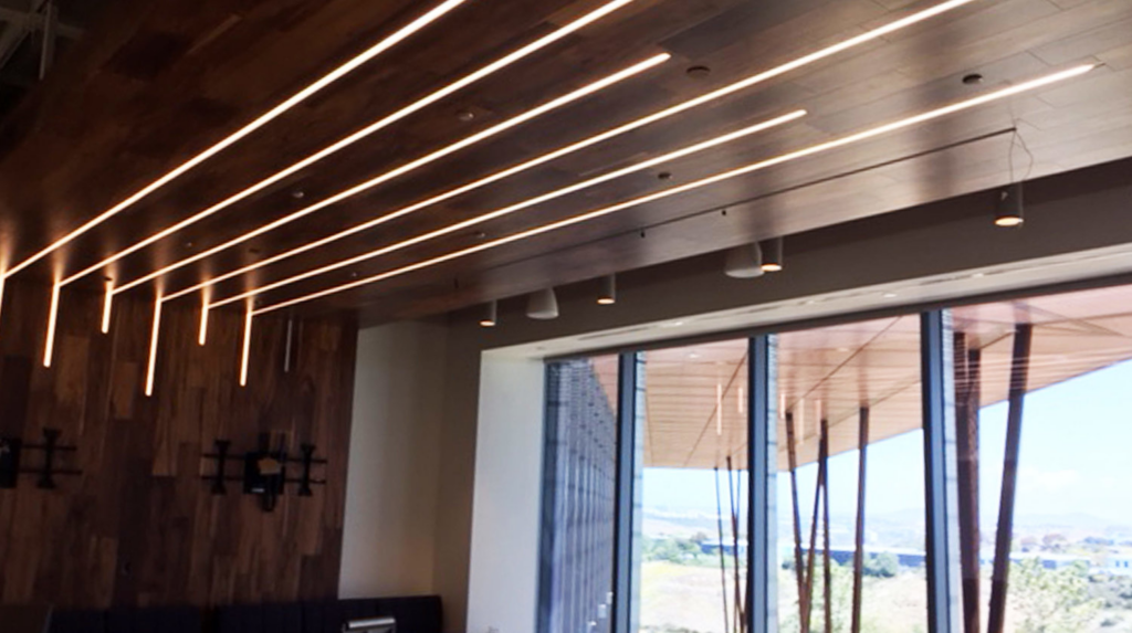 Subtle luminaires near a window.